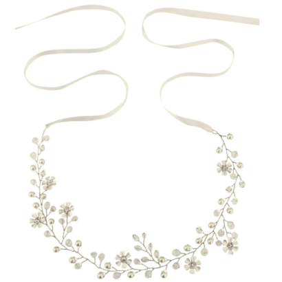 Floral romance hair vine in a chic and classic design, embellished with simulated ivory pearls and clear crystal beads on a silver finish and ivory ribbon. Can be worn as a brow band or headband. Size is approx 1cm wide and 37cm long
